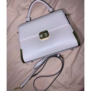 Baby pink with gold detailing purse.